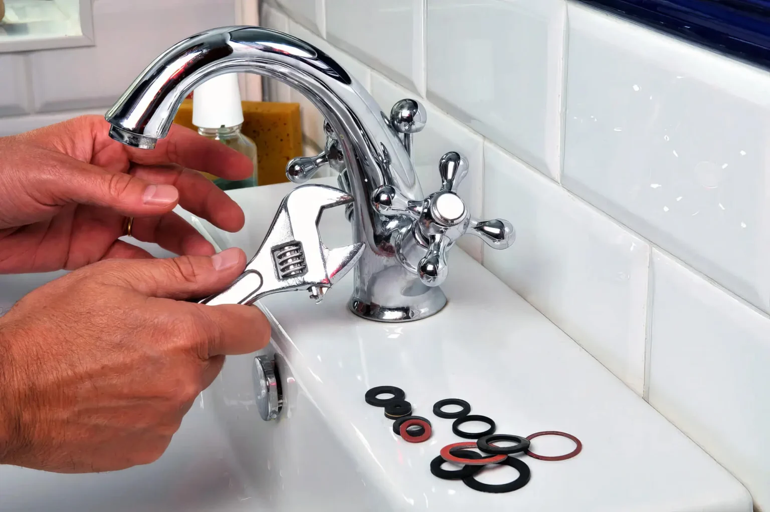 Plumber maintaining a bathroom faucet in San Dimas