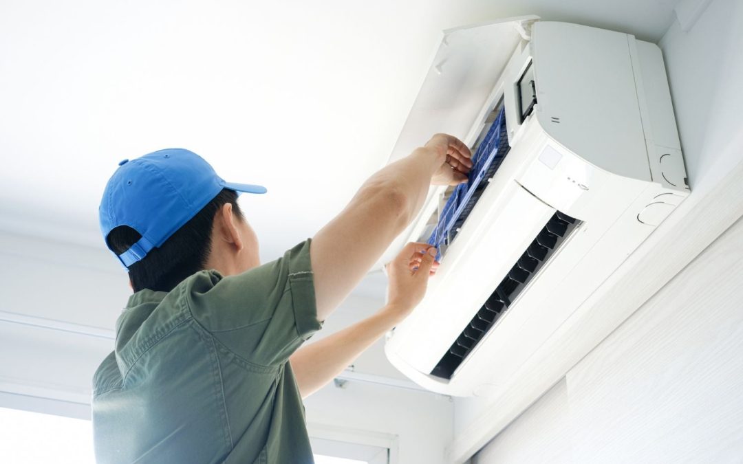 HVAC technician servicing a ductless mini split in San Dimas