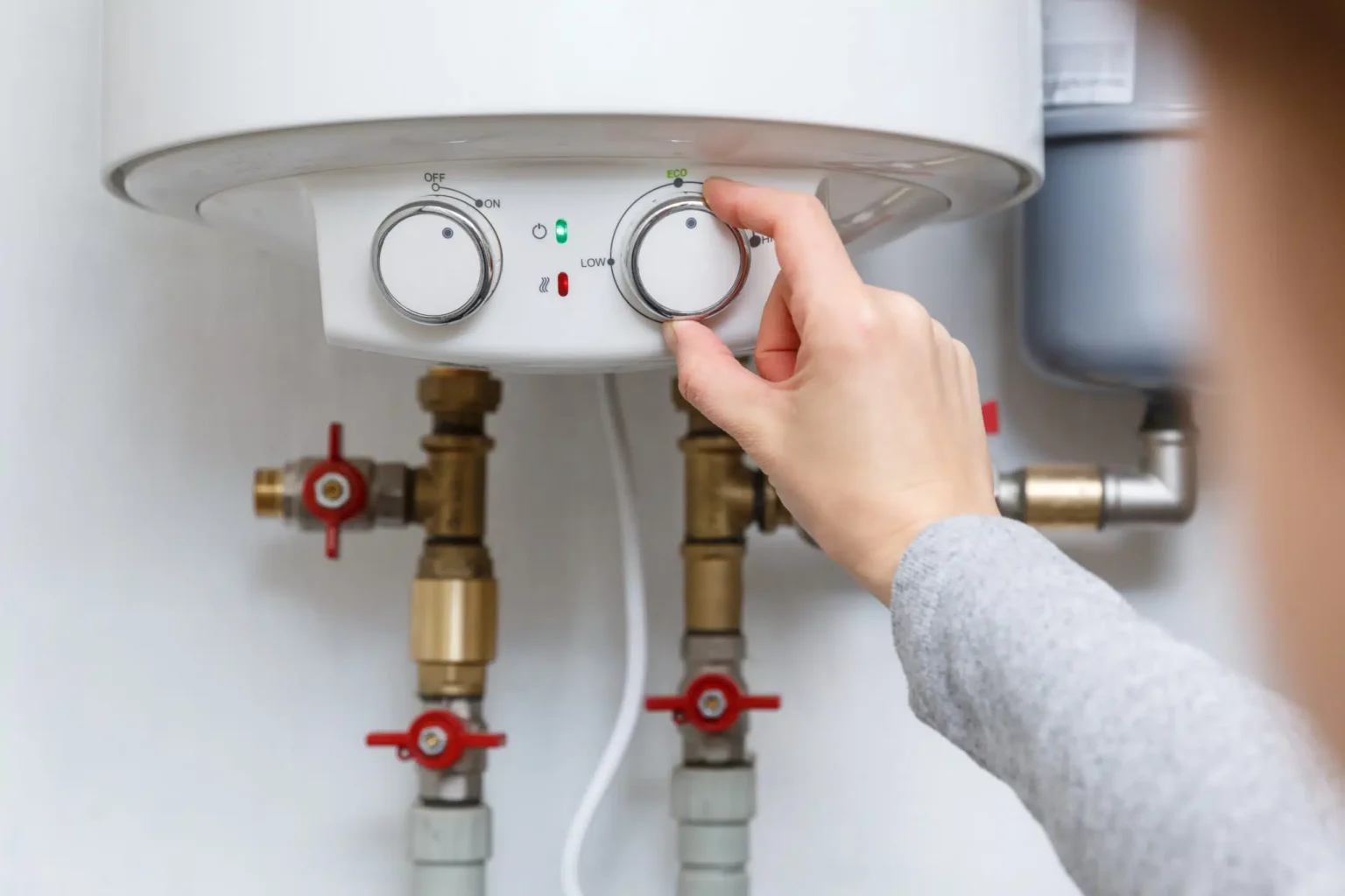 Technician adjusting a water heater in San Dimas